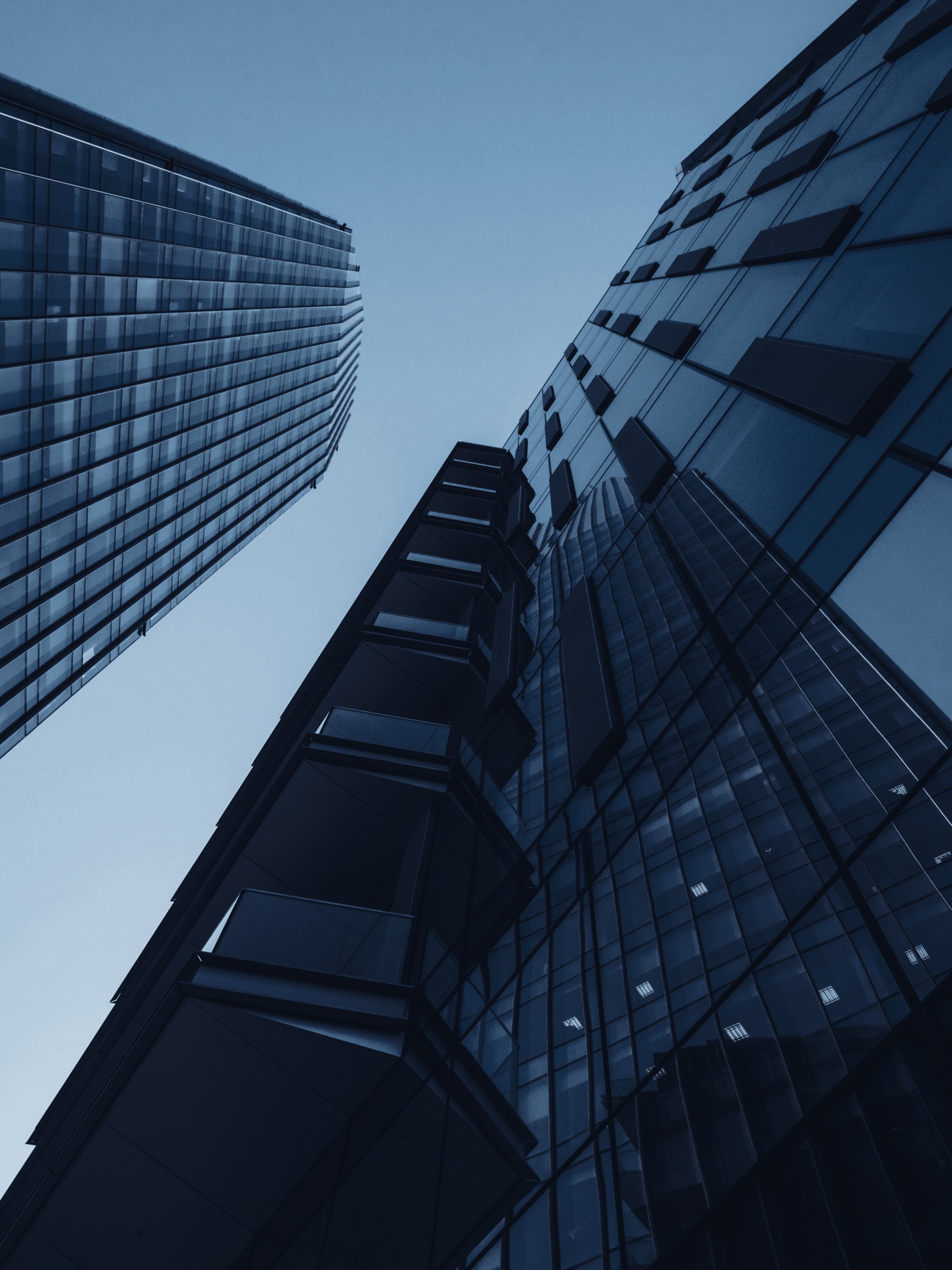 Glass office towers seen from below